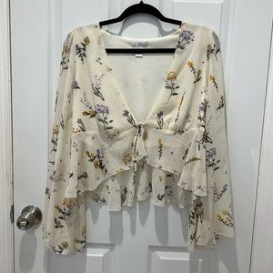 revamped tie cropped shirt, 100% polyester, a cream w/ purple, yellow flowers